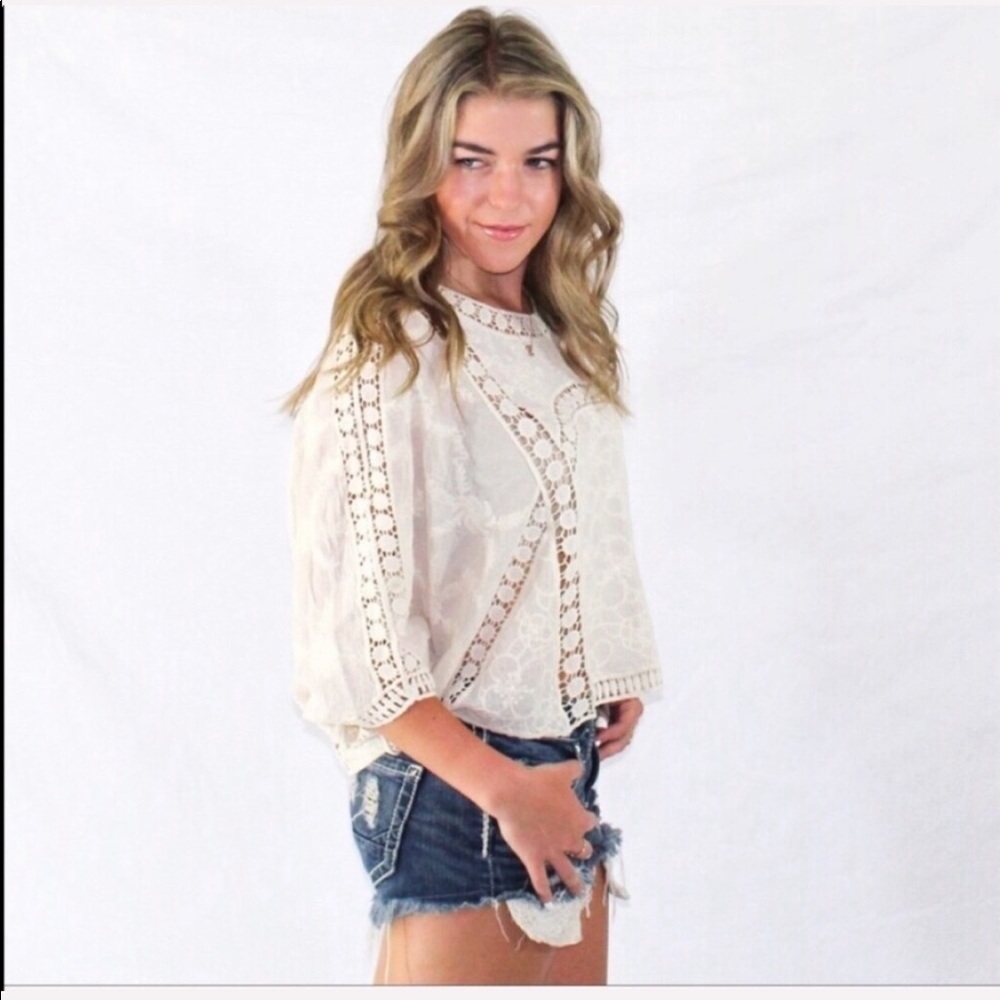 Ivory top with great floral detail. 
100% cotton - Picture 2 of 3